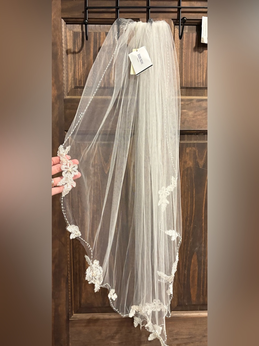 Floral lace and crystal trimmed elbow length veil.